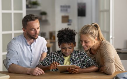 front view parents kid with tablet
