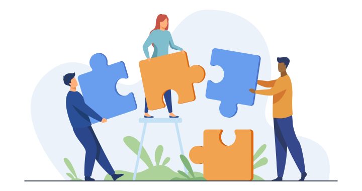 Partners holding big jigsaw puzzle pieces