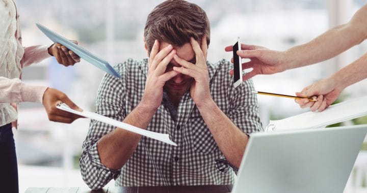 Stressed man frustrated with electronic devices