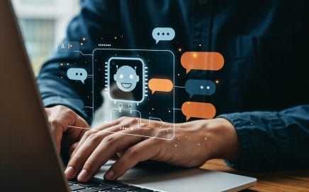 man using laptop with chatbot interface