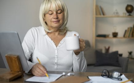 senior woman taking online class her tablet